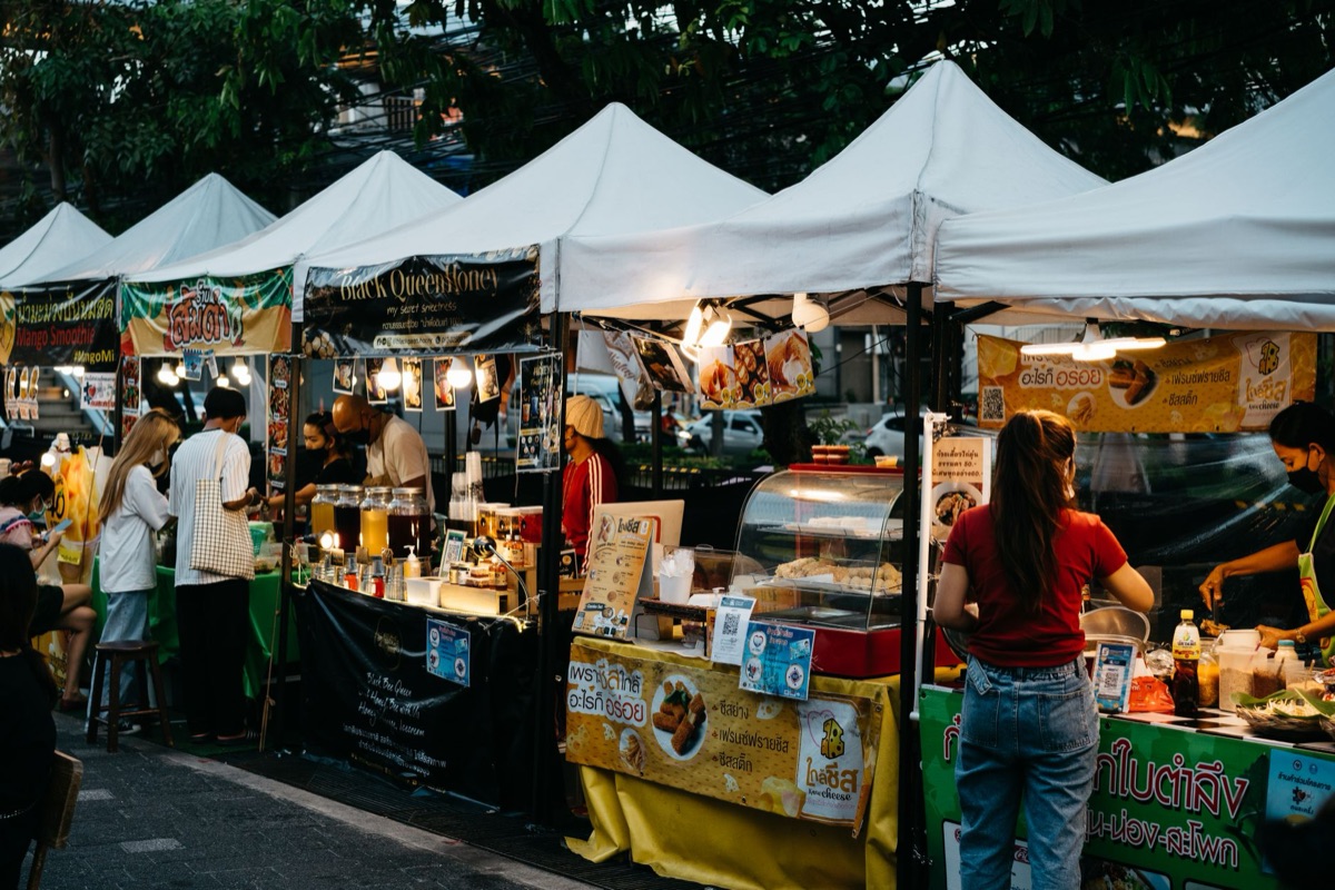 traditional thailand night market with colorful stalls