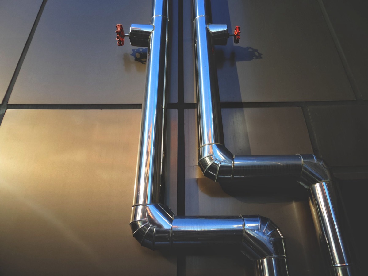 Stainless steel pipe in tropical garden