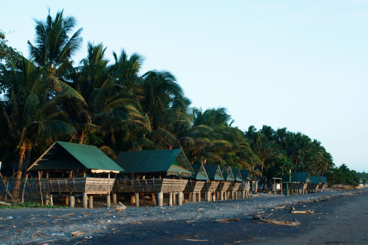 tropical beach with bamboo house