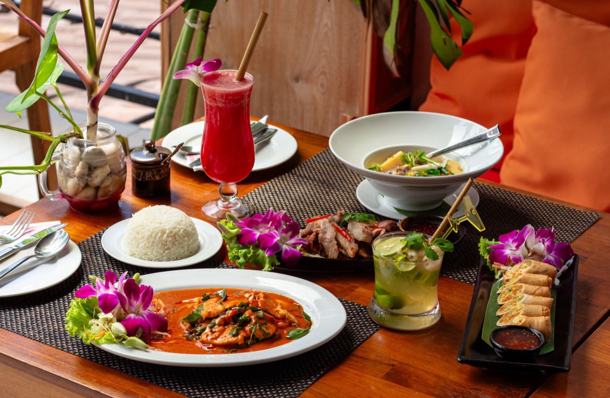 Local restaurant table with tropical fruit and rice dish