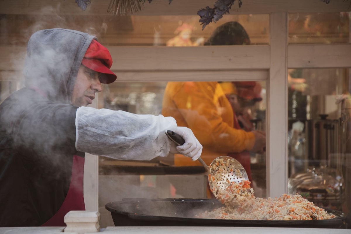 local chef preparing traditional dish